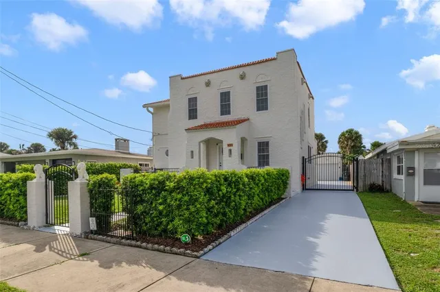 a front view of a house with garden
