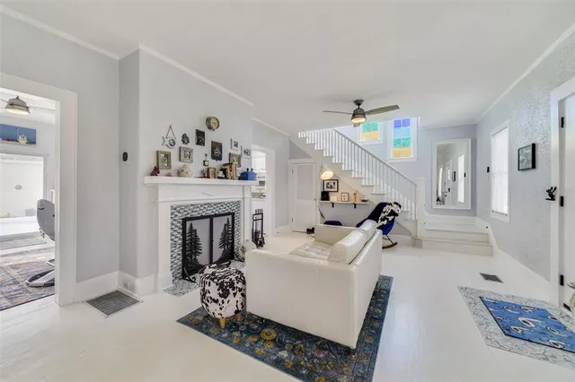 a living room with furniture and a fireplace