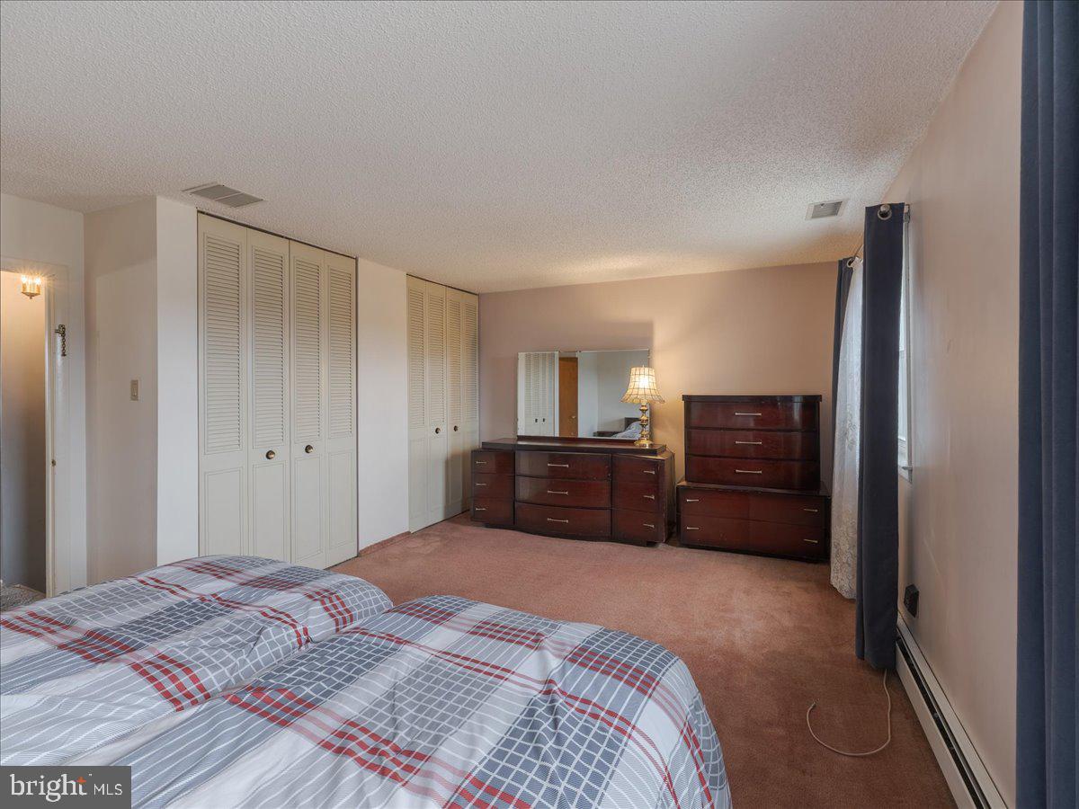 3249 Byberry Road Philadelphia, PA 19154 - Photo 16 of 28 a bedroom with a bed and a view of cabinet
