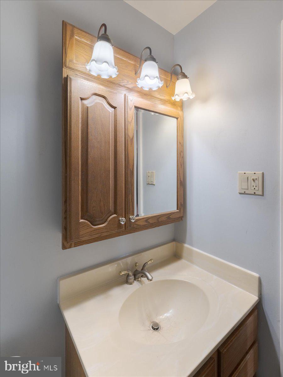 3249 Byberry Road Philadelphia, PA 19154 - Photo 23 of 28 a bathroom with a sink and a mirror