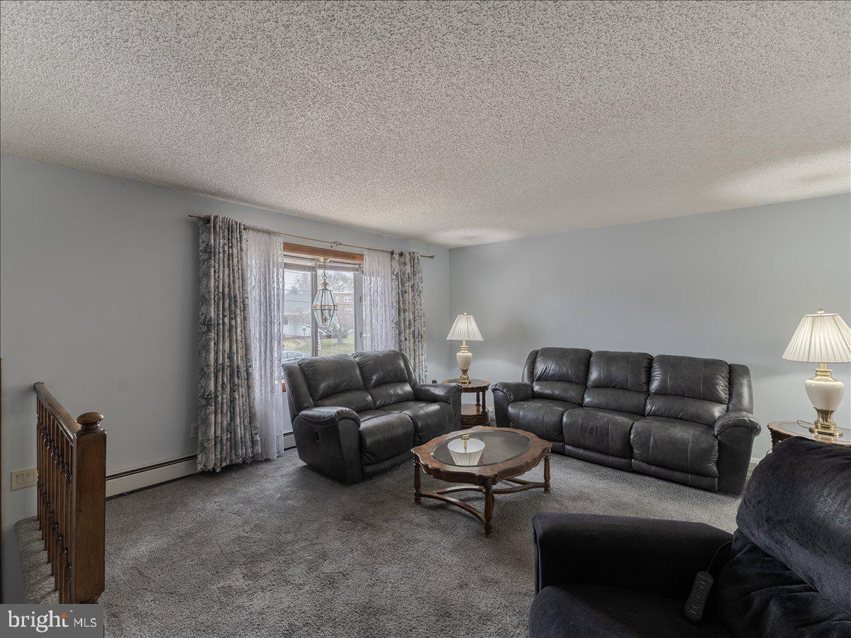 3249 Byberry Road Philadelphia, PA 19154 - Photo 5 of 28 a living room with furniture a couch and a flat screen tv
