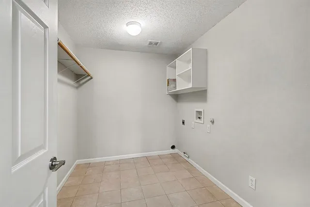 a bathroom with a granite countertop sink a toilet and bathtub