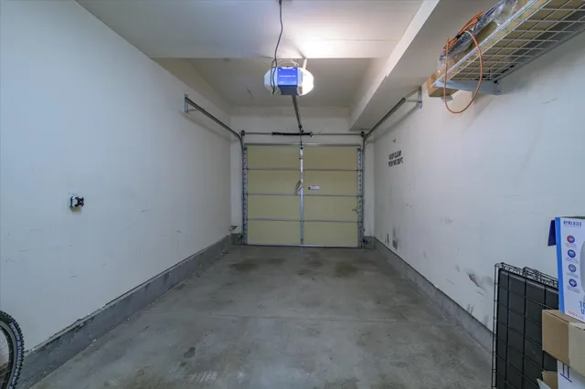 a view of a room with window and ceiling fan