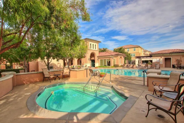a building outdoor space with patio furniture and a potted plant