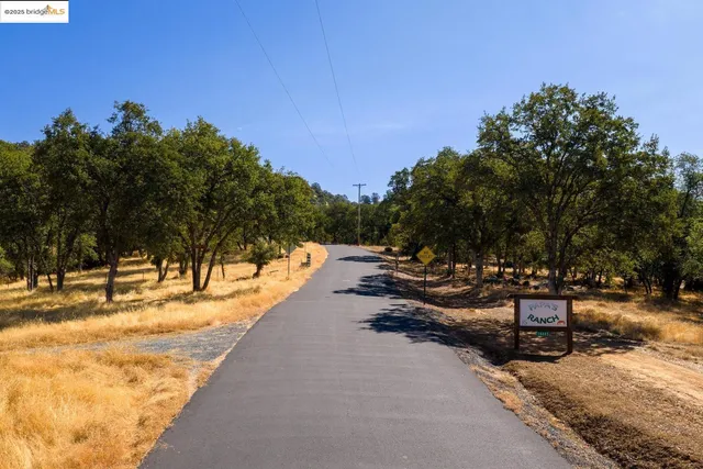 an aerial view of residential houses with city view