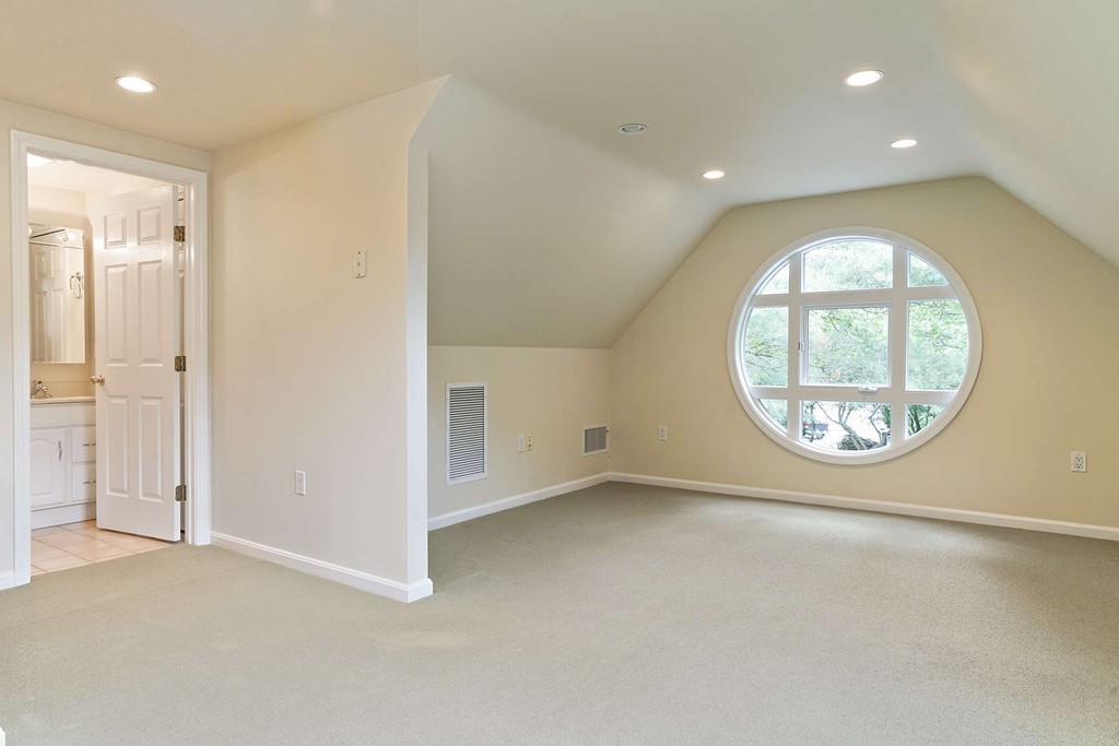 2 Hampton Road Lexington, MA 02421 - Photo 27 of 30 an empty room with a large window and a mirror