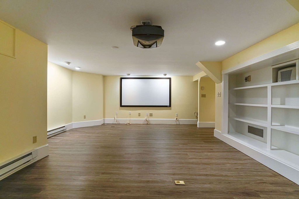 2 Hampton Road Lexington, MA 02421 - Photo 30 of 30 a view of an empty room with wooden floor and a window