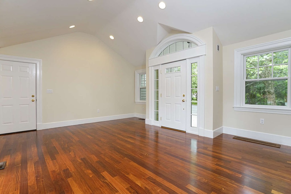 2 Hampton Road Lexington, MA 02421 - Photo 8 of 30 an empty room with wooden floor and windows