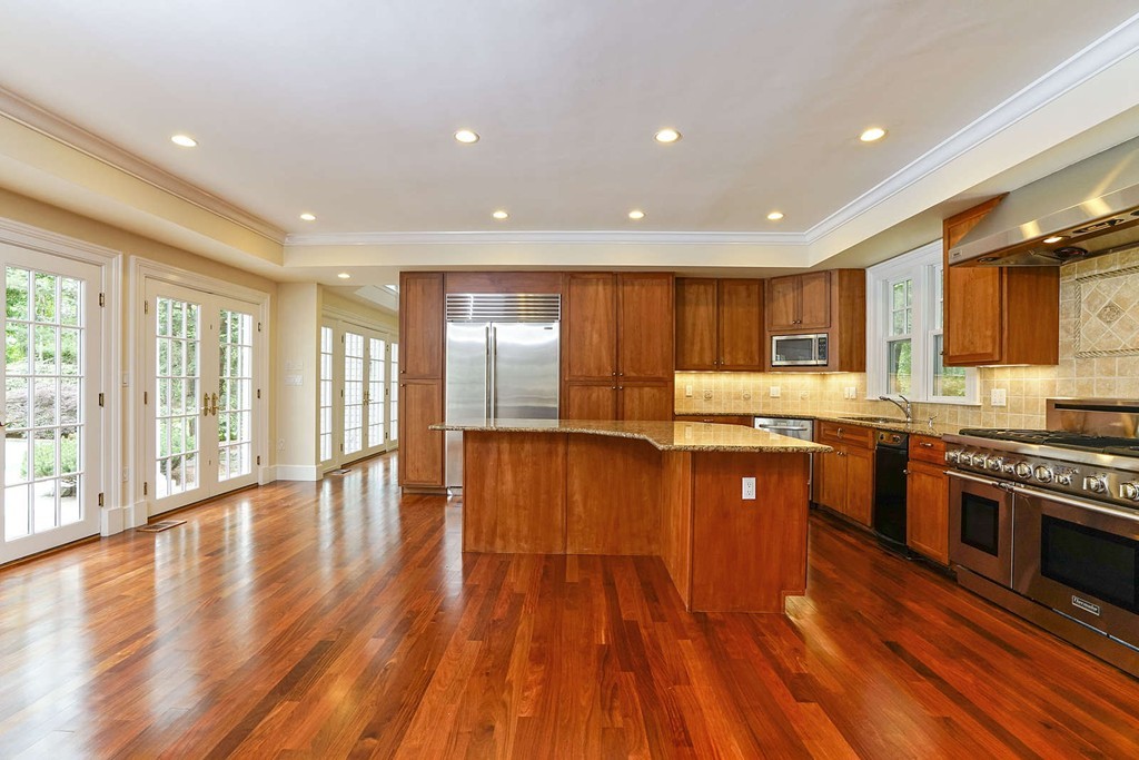 2 Hampton Road Lexington, MA 02421 - Photo 9 of 30 a kitchen with stainless steel appliances granite countertop wooden cabinets a stove a sink and a large window