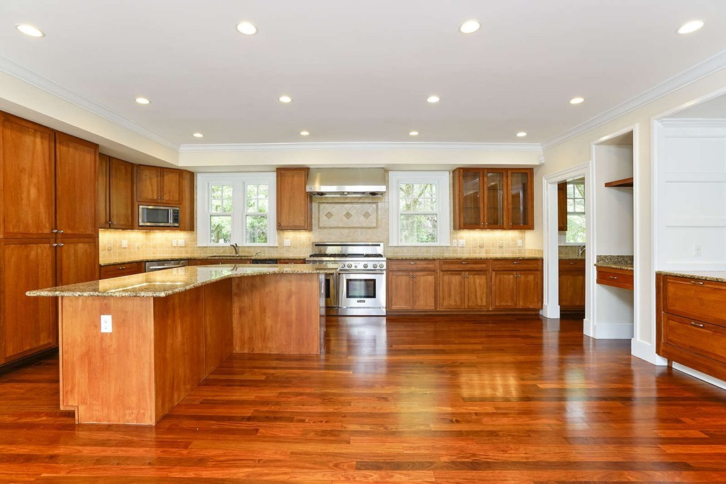 2 Hampton Road Lexington, MA 02421 - Photo 10 of 30 a large kitchen with stainless steel appliances granite countertop a large counter top a stove and a sink