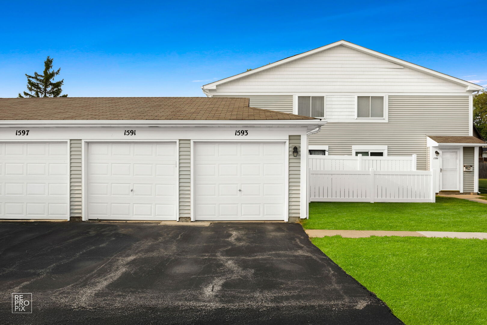 1593 Cornell Place Hoffman Estates, IL 60169 - Photo 1 of 18 a front view of a house with a yard