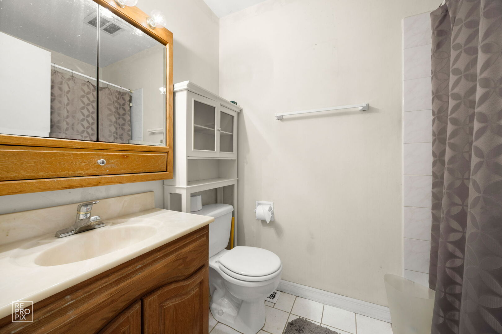 1593 Cornell Place Hoffman Estates, IL 60169 - Photo 12 of 18 a bathroom with a sink a toilet and shower