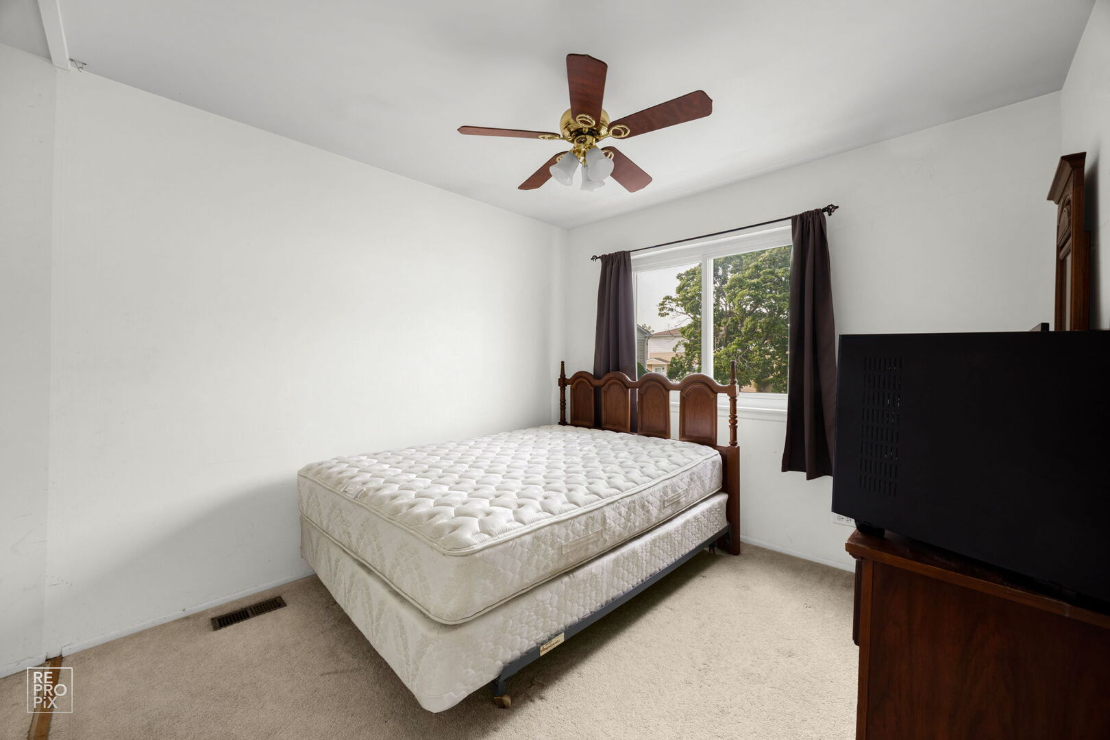1593 Cornell Place Hoffman Estates, IL 60169 - Photo 13 of 18 a bedroom with a bed and a flat screen tv