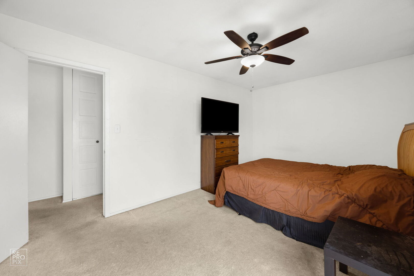 1593 Cornell Place Hoffman Estates, IL 60169 - Photo 8 of 18 a bedroom with a bed and a ceiling fan