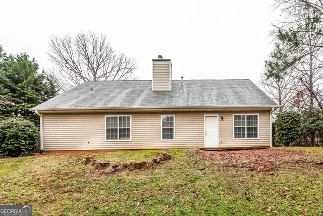 a house view with a backyard space