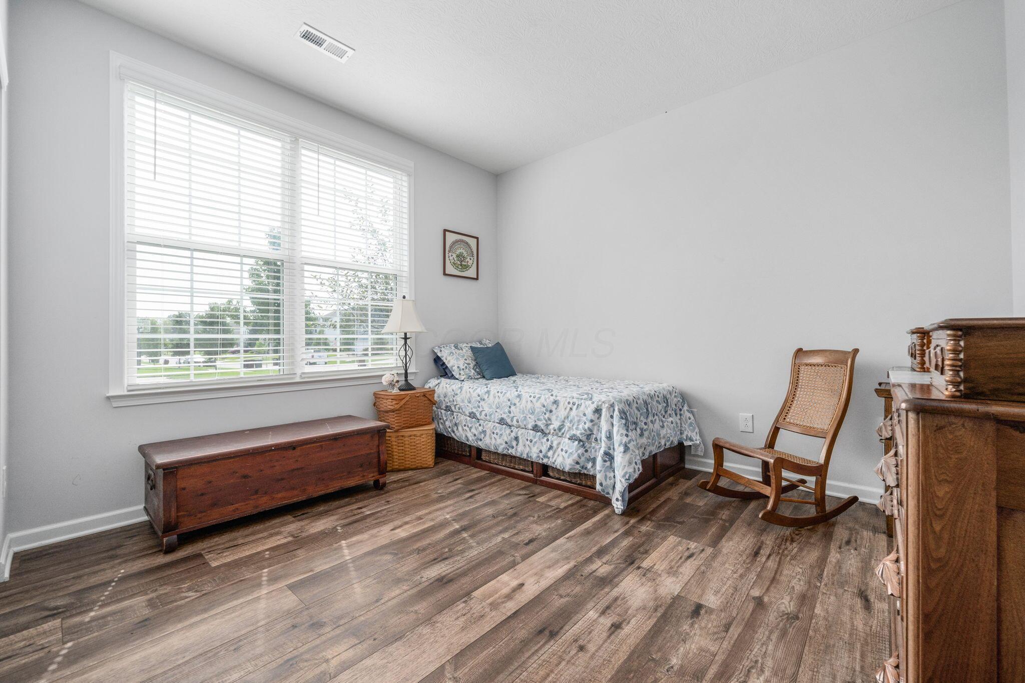 727 Fescue Road Galena, OH 43021 - Photo 46 of 85 The other 1st floor bedroom has LVP flooring, double windows and a ceiling fan rough-in.