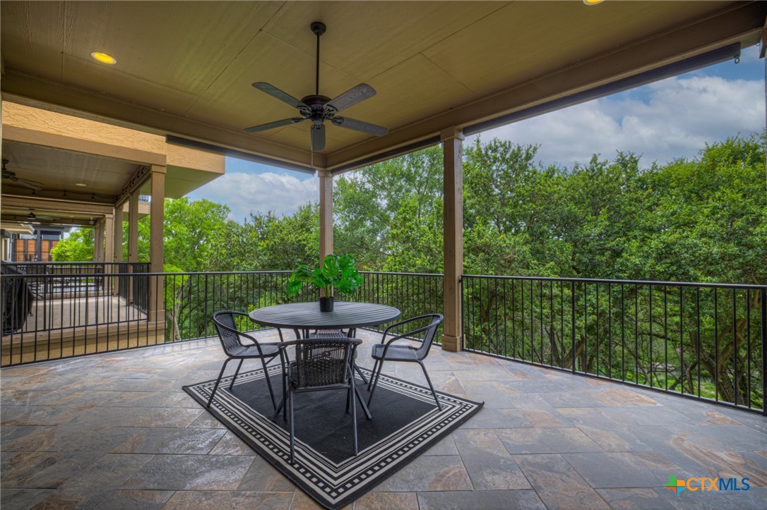 1029 Gruene Road New Braunfels, TX 78130 - Photo 32 of 48 a view of a patio with a table chairs and a backyard