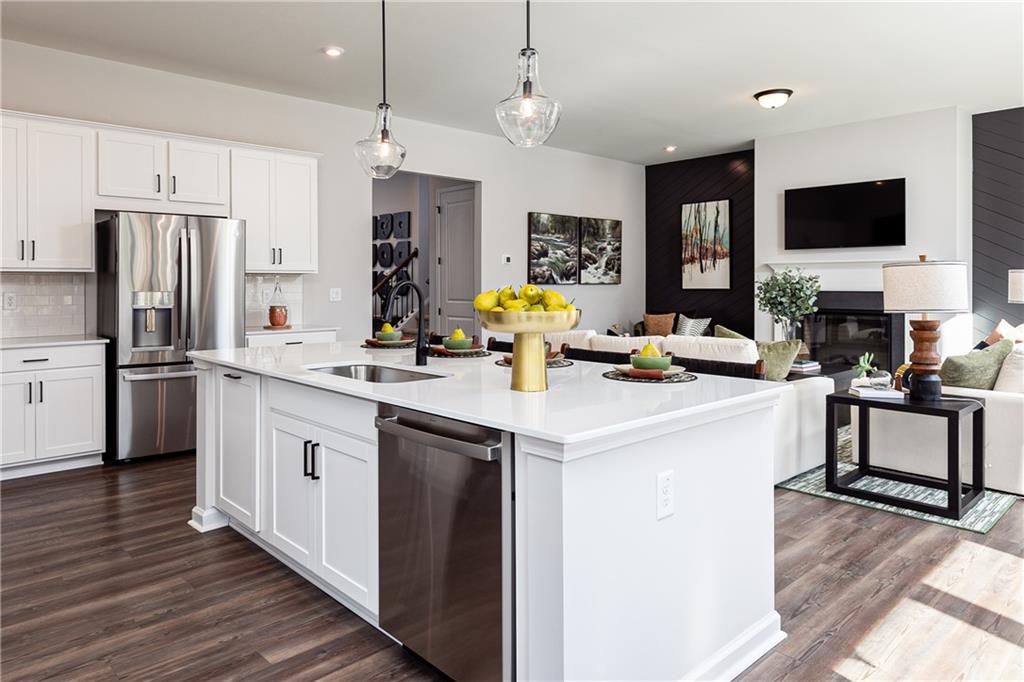 3210 Croftside Commons Powder Springs, GA 30127 - Photo 15 of 57 a kitchen with stainless steel appliances a sink stove and refrigerator