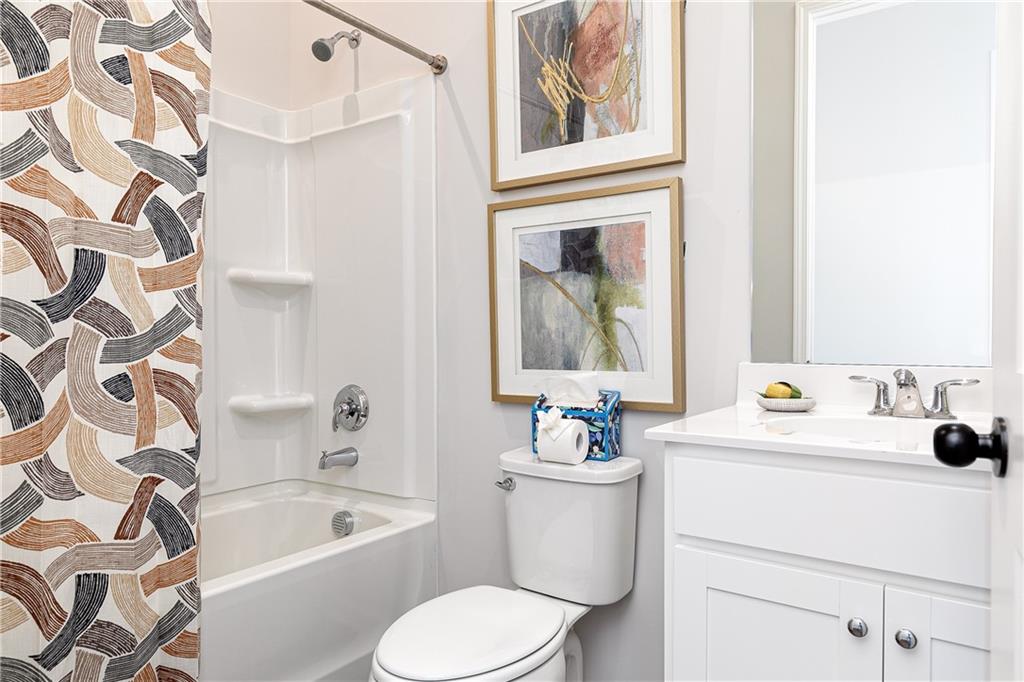3210 Croftside Commons Powder Springs, GA 30127 - Photo 24 of 57 a bathroom with a sink a toilet and a bathtub