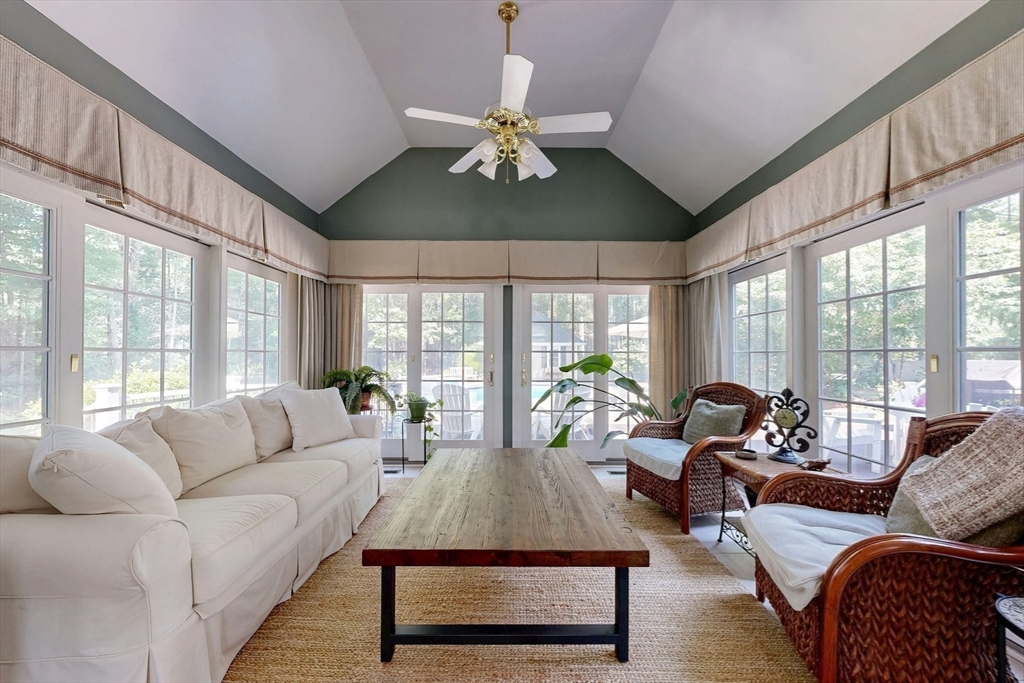 7 Riverbend Road Upton, MA 01568 - Photo 16 of 39 a living room with furniture chandelier and a large window