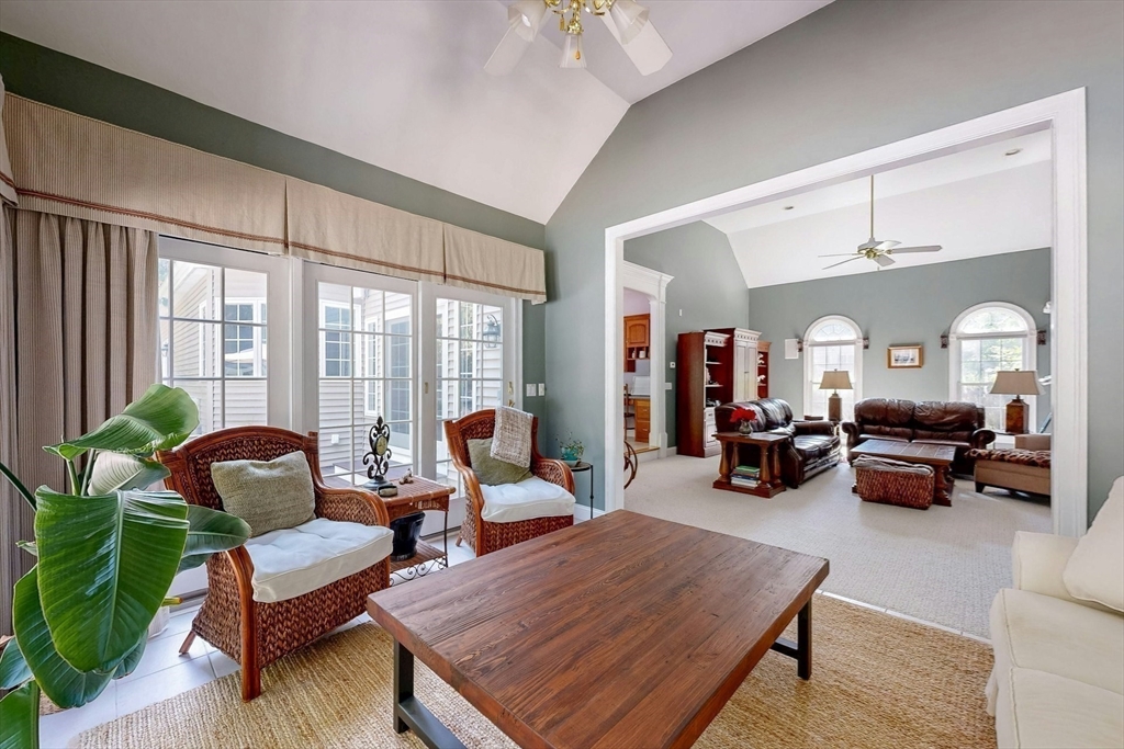 7 Riverbend Road Upton, MA 01568 - Photo 17 of 39 a living room with furniture couches and a dining table with garden view