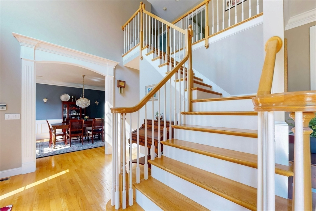 7 Riverbend Road Upton, MA 01568 - Photo 19 of 39 a view of entryway livingroom and hall with wooden floor and a dining room