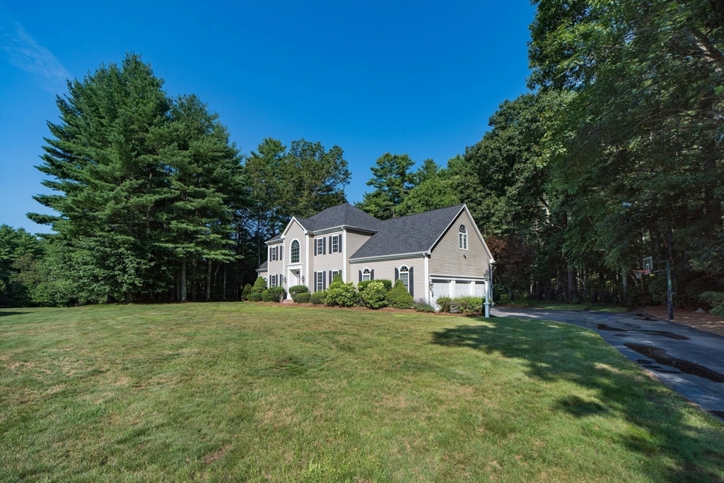 7 Riverbend Road Upton, MA 01568 - Photo 2 of 39 a front view of a house with a garden