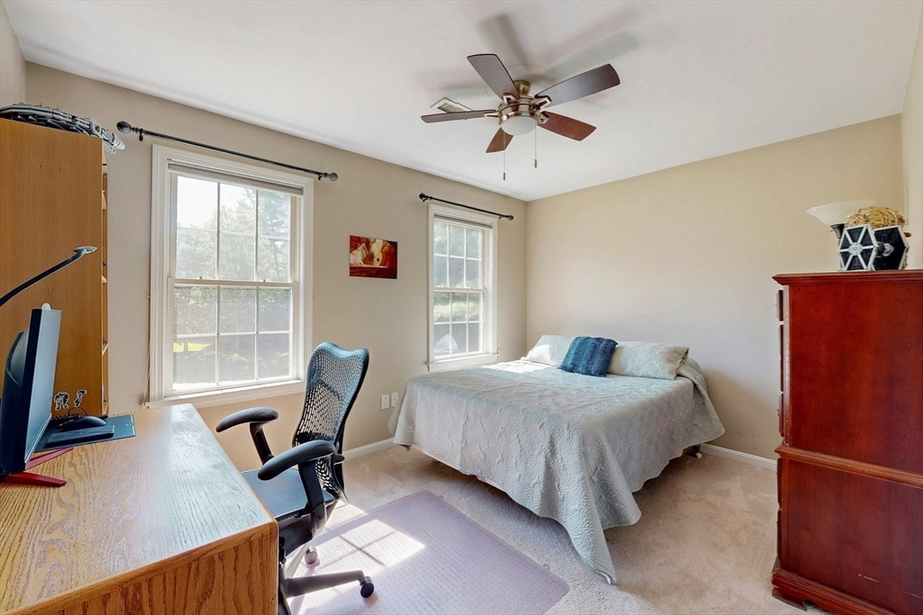 7 Riverbend Road Upton, MA 01568 - Photo 24 of 39 a bedroom with a bed a chair and a large window