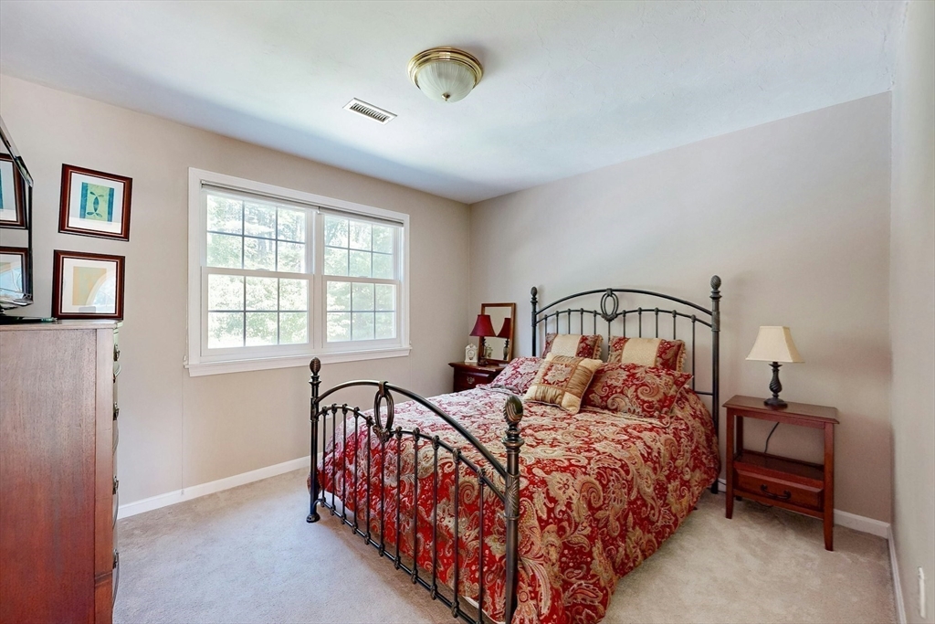 7 Riverbend Road Upton, MA 01568 - Photo 26 of 39 a bedroom with a bed next to a window