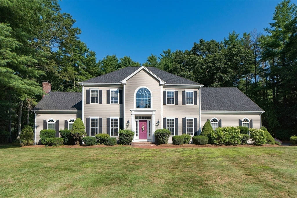 7 Riverbend Road Upton, MA 01568 - Photo 3 of 39 a front view of a house with a garden