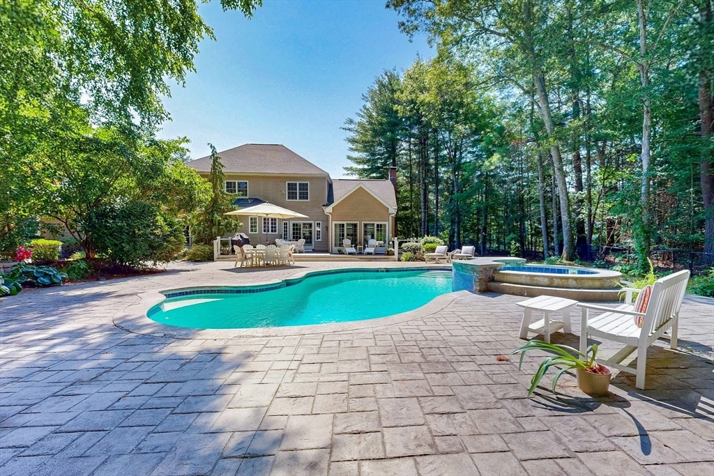 7 Riverbend Road Upton, MA 01568 - Photo 31 of 39 a house view with a swimming pool and sitting space