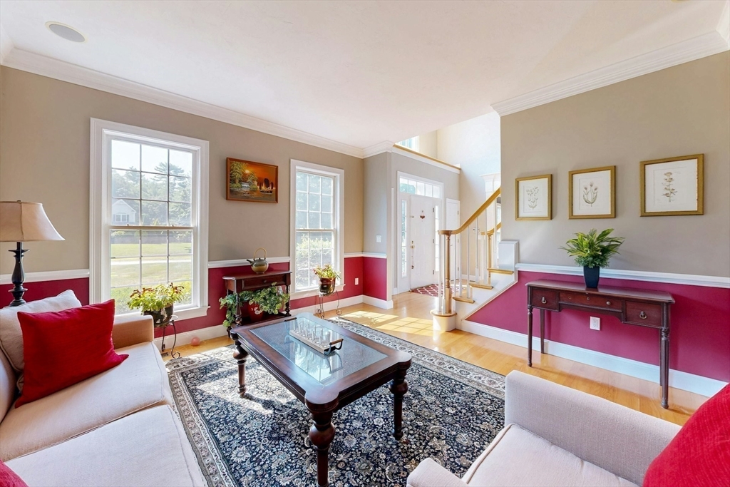 7 Riverbend Road Upton, MA 01568 - Photo 5 of 39 a living room with furniture a red lamp and a large window