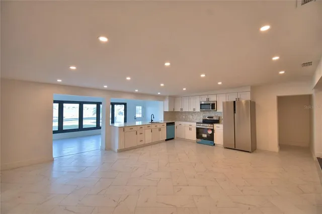 a view of kitchen and windows