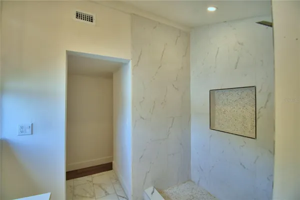 a bathroom with a shower and a toilet
