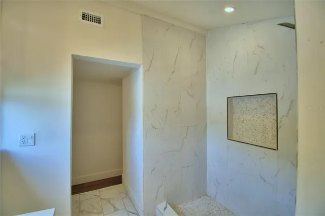 a bathroom with a shower and a toilet