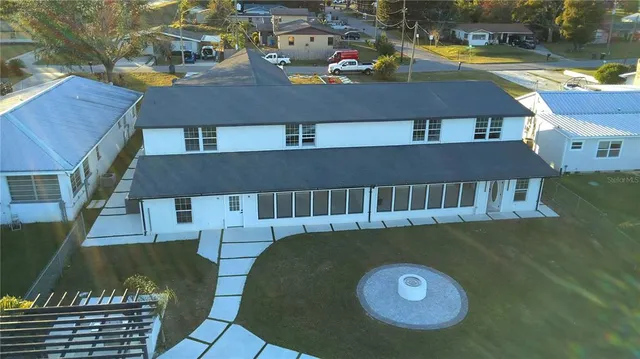 an aerial view of a house with swimming pool