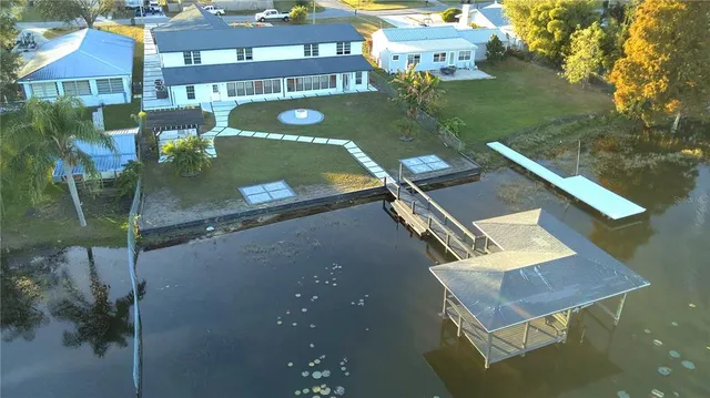 a view of a pool with chairs