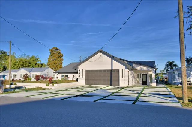 a house view with swimming pool and porch