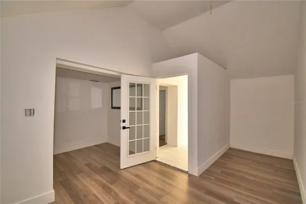a view of front door with wooden floor