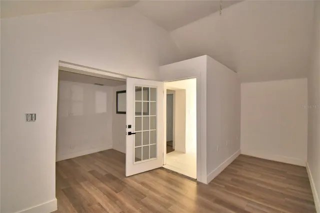a view of front door with wooden floor