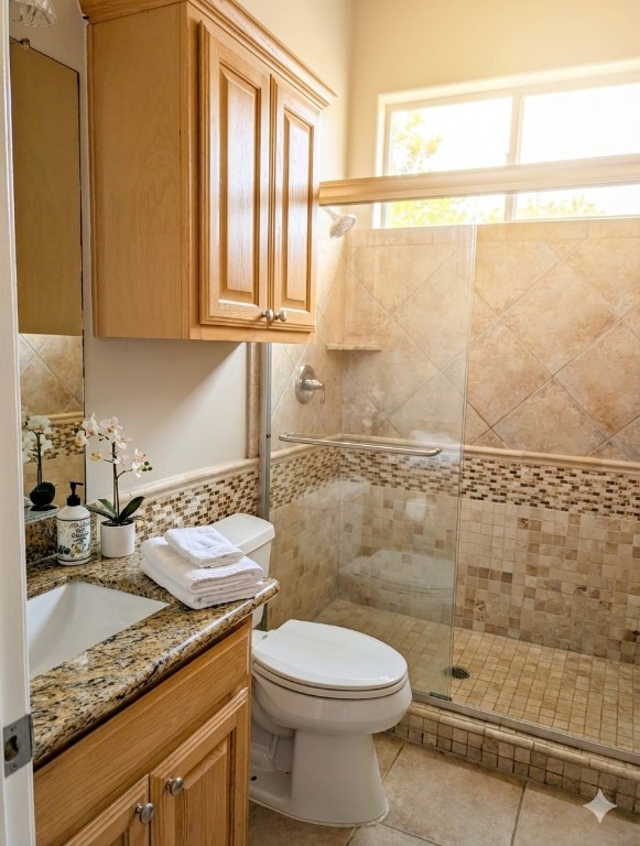 5 Anderson Crossing Cedar Park, TX 78613 - Photo 14 of 25 a bathroom with a granite countertop sink a toilet and a shower