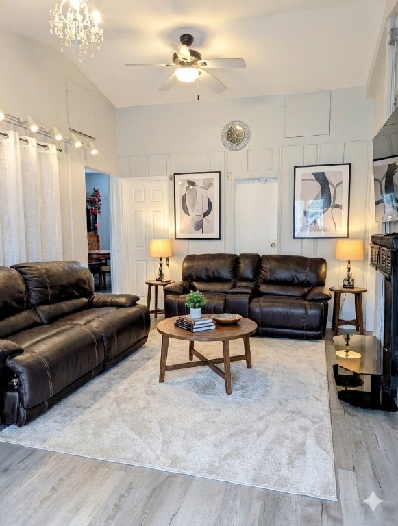 5 Anderson Crossing Cedar Park, TX 78613 - Photo 24 of 25 a living room with furniture and a chandelier