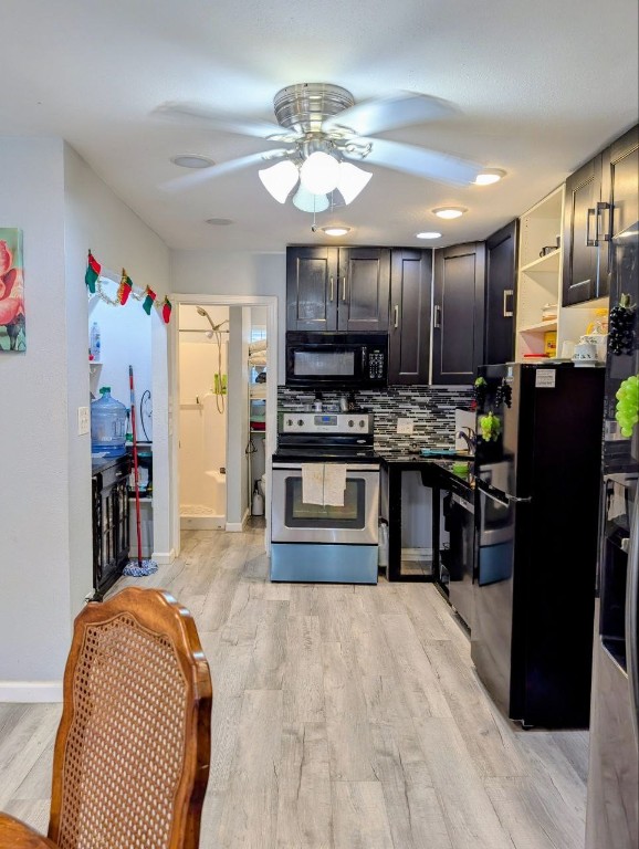 5 Anderson Crossing Cedar Park, TX 78613 - Photo 25 of 25 a kitchen with stainless steel appliances kitchen island granite countertop a refrigerator oven a sink a dining table and chairs with wooden floor