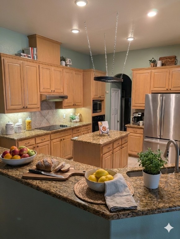 5 Anderson Crossing Cedar Park, TX 78613 - Photo 9 of 25 a kitchen with sink a refrigerator and chairs
