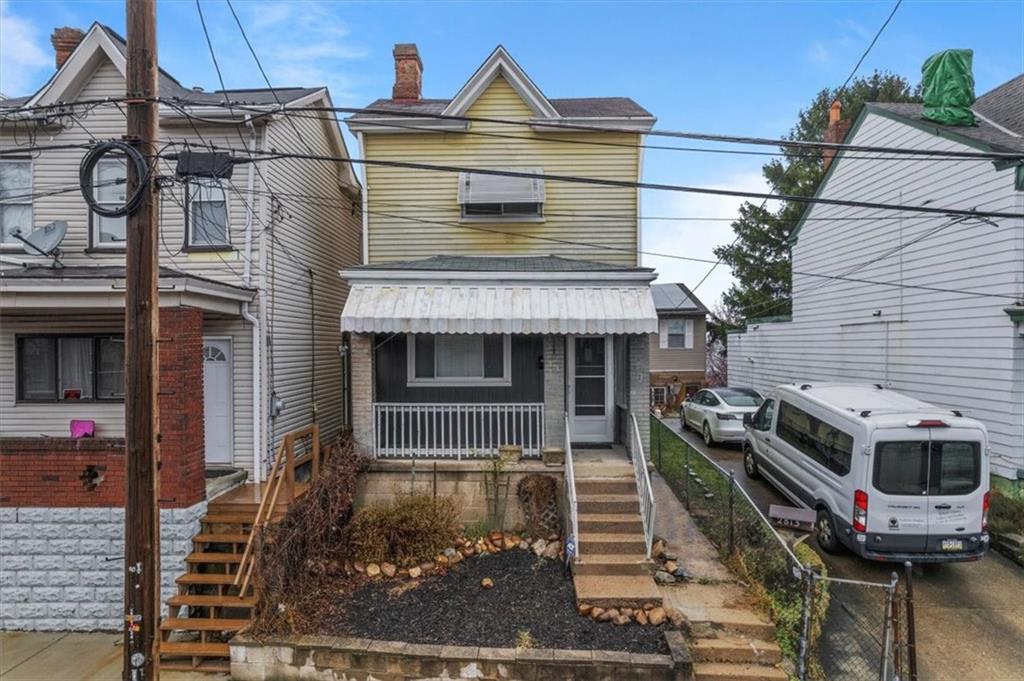 2811 Cobden Street Pittsburgh, PA 15203 - Photo 24 of 32 a front view of a house with a garage