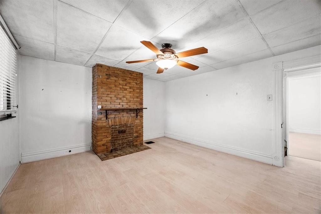 2811 Cobden Street Pittsburgh, PA 15203 - Photo 10 of 32 an empty room with windows and ceiling fan