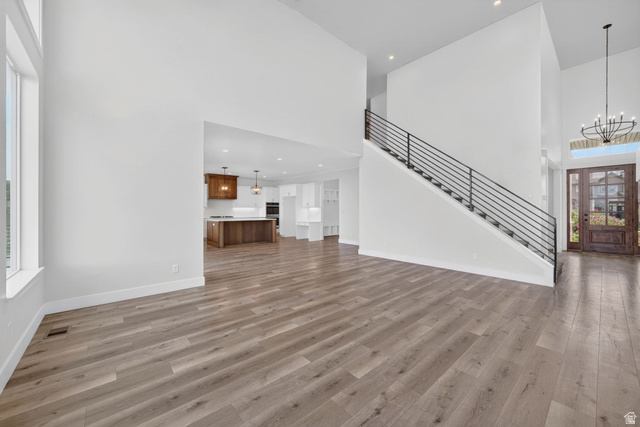 1002 West Temple Rim Lane Payson, UT 84651 - Photo 13 of 68 Spacious interior with wood-finish flooring and a contemporary staircase featuring black horizontal balusters