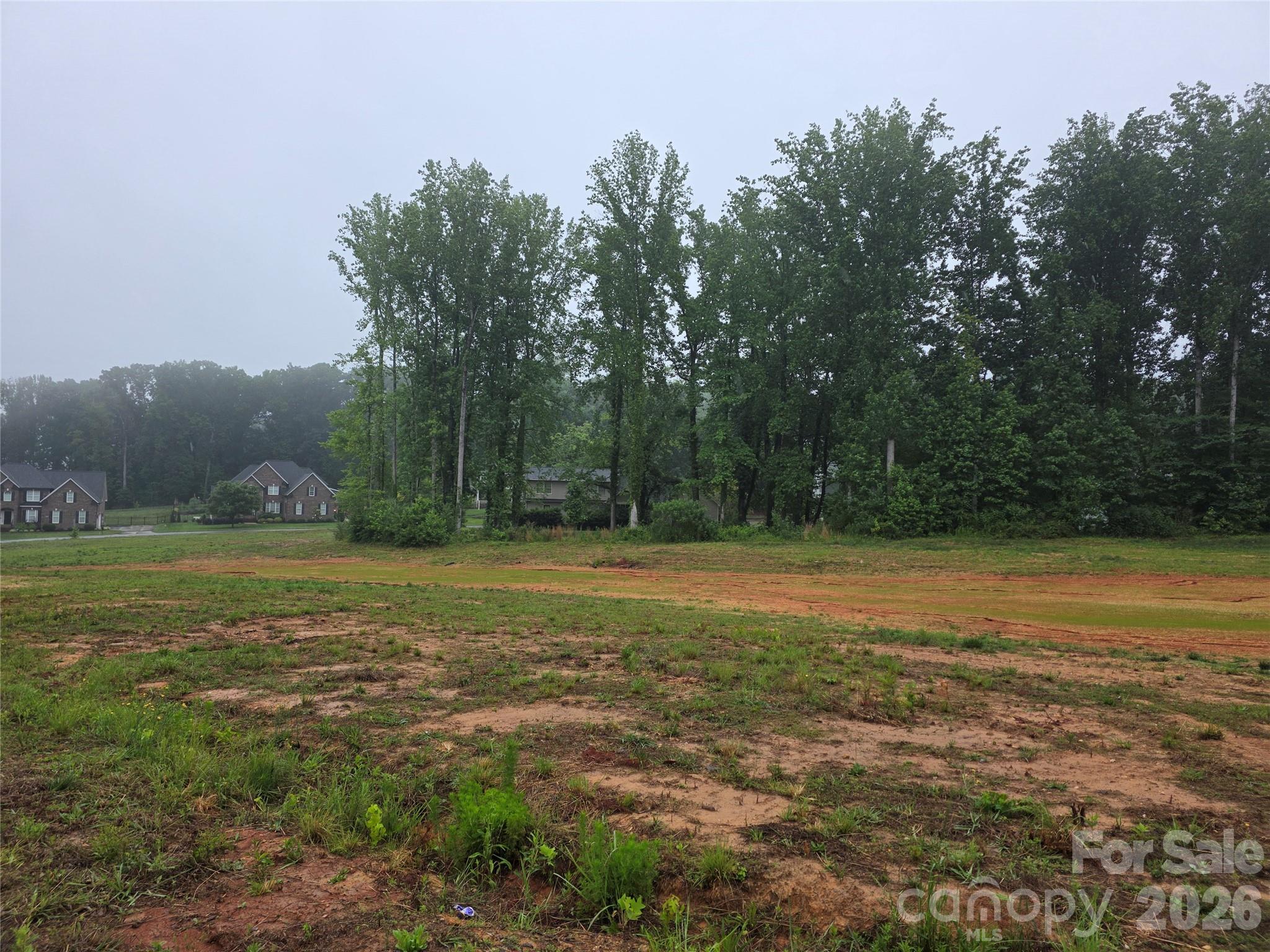 1815 Gaston Day School Road Gastonia, NC 28056 - Photo 1 of 3 a view of a field with trees in the background