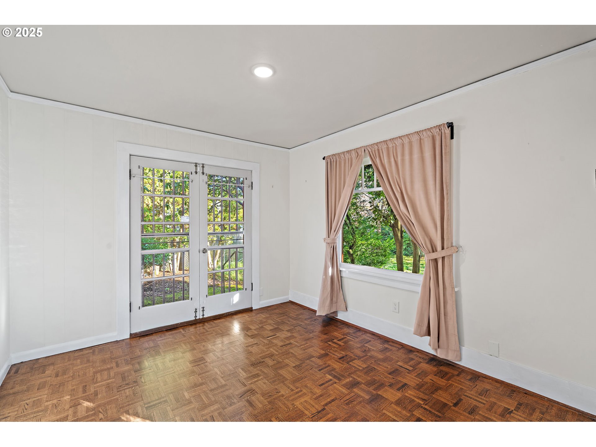 7139 Southeast 78th Avenue Portland, OR 97206 - Photo 13 of 41 a view of an empty room with wooden floor and a window