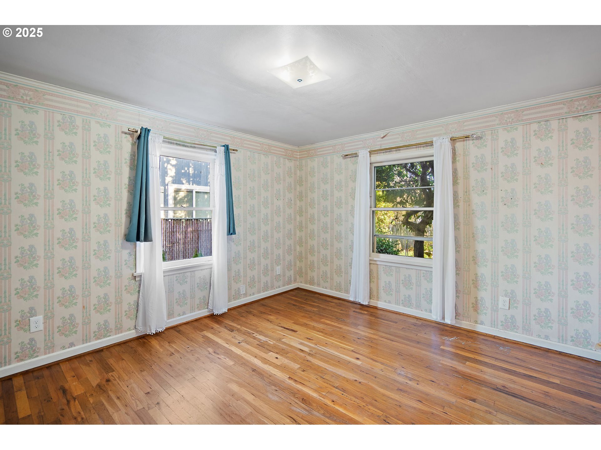 7139 Southeast 78th Avenue Portland, OR 97206 - Photo 25 of 41 a view of an empty room with wooden floor and a window